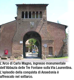 L'Arco di Carlo Magno, ingresso monumentale dell'Abbazia delle Tre Fontane sulla Via Laurentina. L'episodio della conquista di Ansedonia è affrescato nel sottarco.